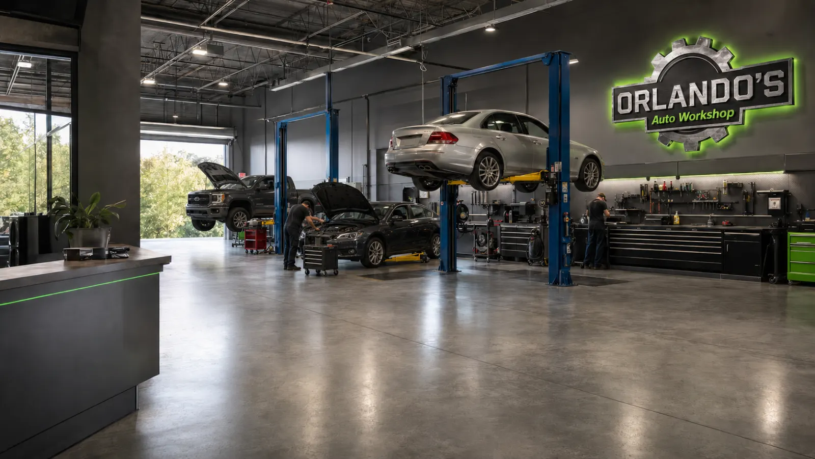 Interior of Orlando's Auto Workshop showing vehicles on lifts and a fully equipped repair bay